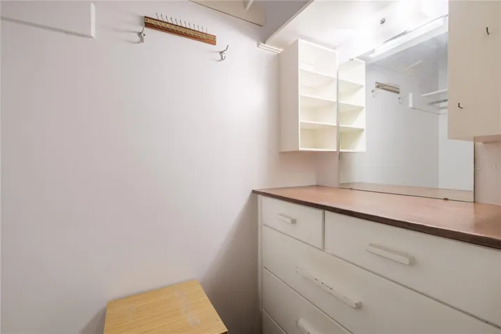 One of three storage closets off primary bedroom hallway