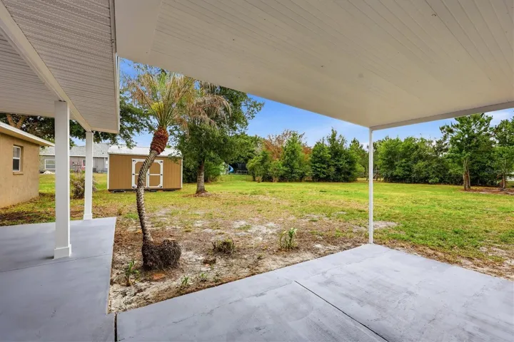 Back patio outside Primary suite and bonus room faces south and is covered by a flat roof.