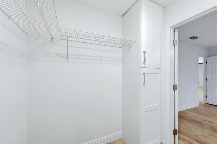 Walk-in closet with storage cabinet for linens and more!  Or customize this space as you see fit!