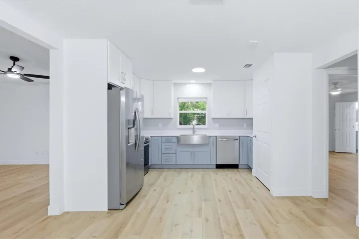 The kitchen is the heart of this home directly in the center, overlooking the backyard.