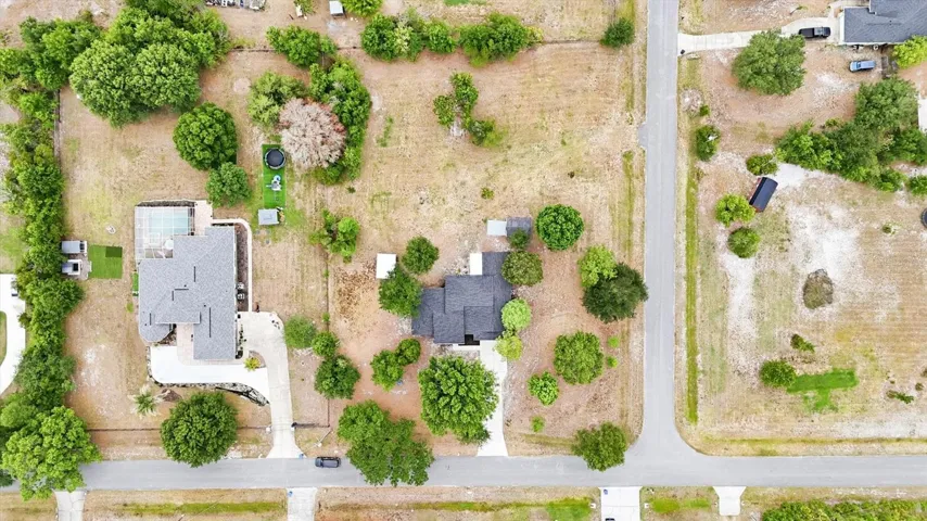 Overhead aerial shows how well spaced out the properties are!  Convenient corner lot provides access from side street into back yard if desired