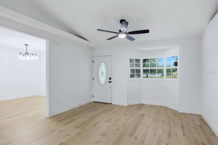 Front door entry features a bay style window