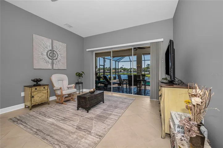 Living Room with Pool and Pond View