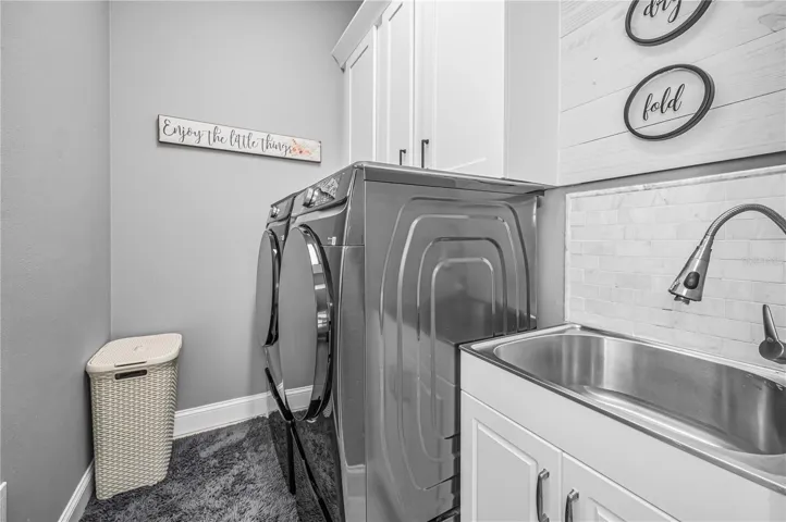 Laundry Room off Kitchen w/Samsung front end loading Washer and Dryer