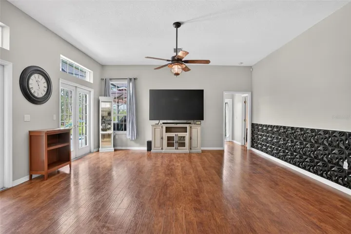 Family room/ great room with french doors to the pool lanai