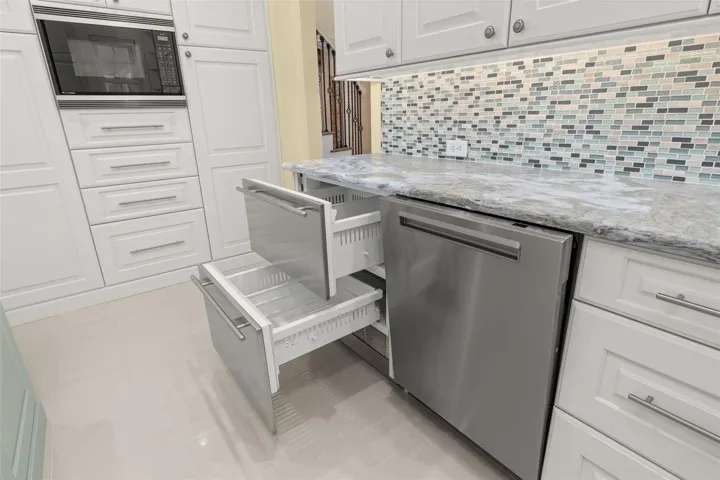 Miele Dishwasher & Sub Zero Under Counter Frdge