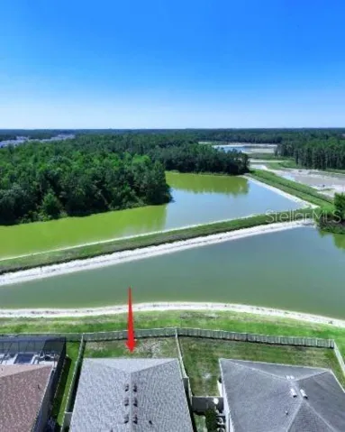 Aerial view of the pond at the rear of the house