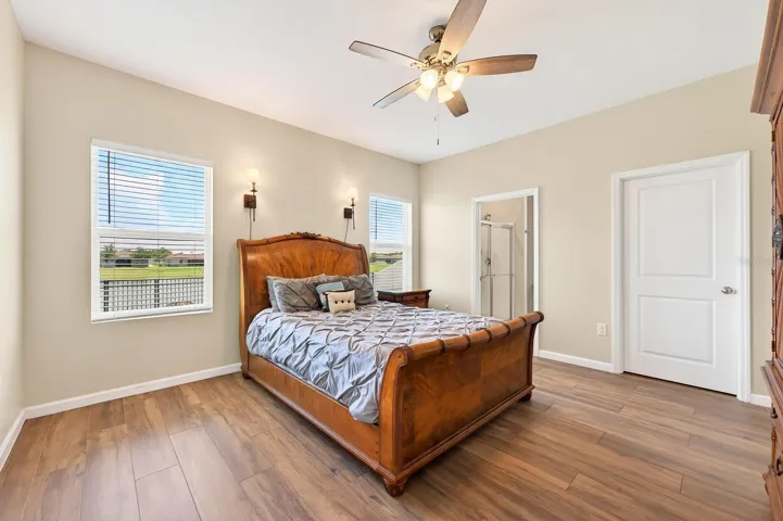 Light, bright primary suite delivers a walk-in closet and private bath.