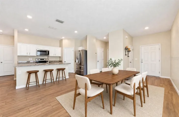 Start your tour in the chef's kitchen and open dining space, perfect for everyday living or entertaining. Virtually Staged.
