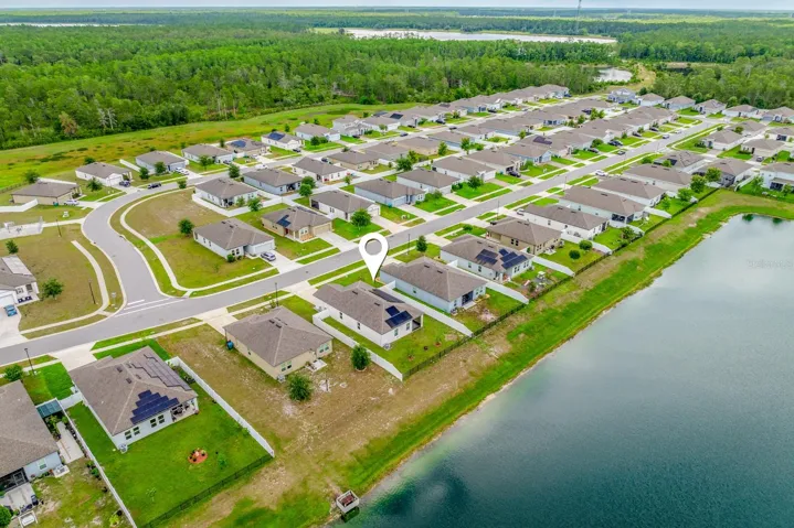 Premium pond lot in a community surrounded by beautiful trees.