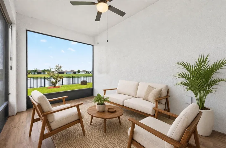Tiled, screened lanai is complete with a ceiling fan and water views. Virtually Staged.