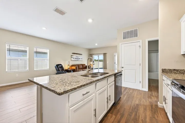 Kitchen is open to the living and dining areas.
