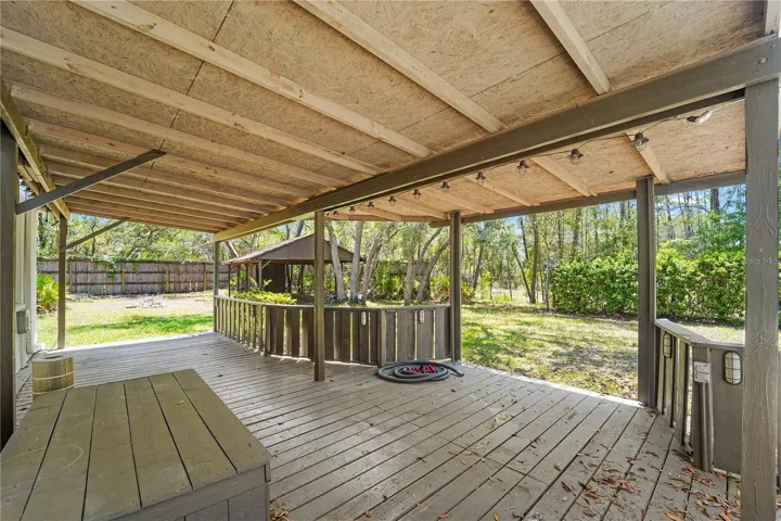 additional deck, pole barn in back ground