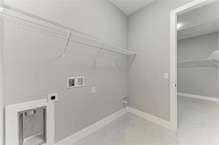 LAUNDRY ADJOINS MASTER BEDROOM