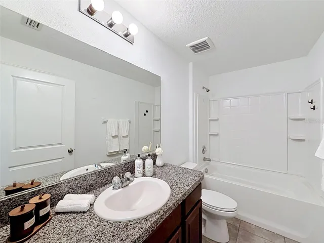 Hall (guest) bathroom. Linen closet behind the door!