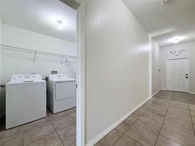 Foyer leading to laundry room and garage.