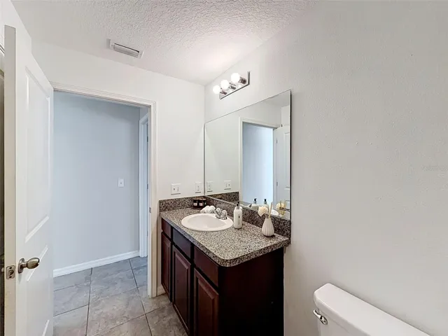 Hall (guest) bathroom. Linen closet behind the door!
