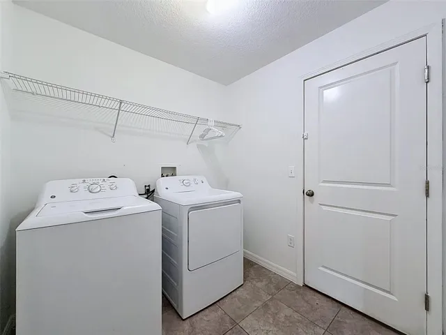 Laundry room leading to garage.