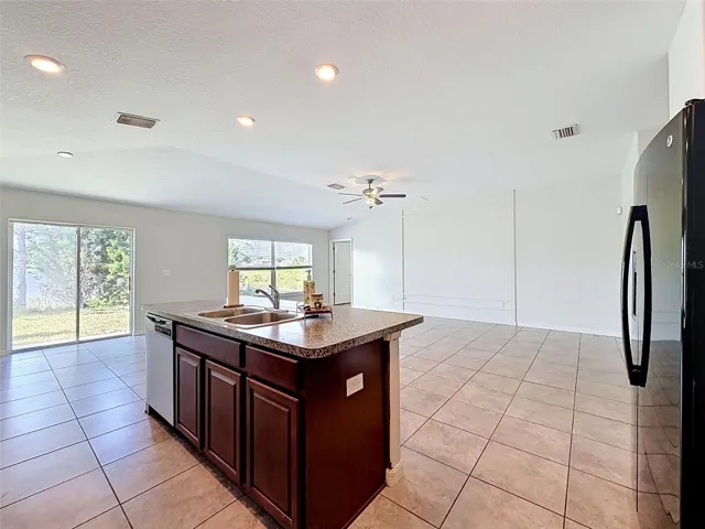 BIG, well-lit kitchen. Open to gathering spaces.
