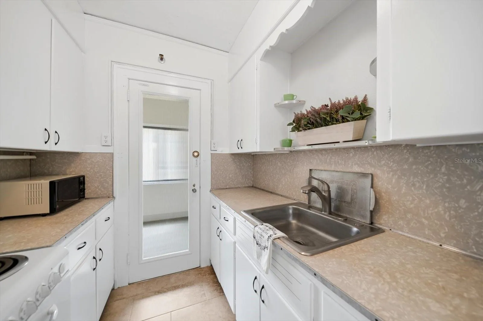 The kitchen opens to the common hallway.
