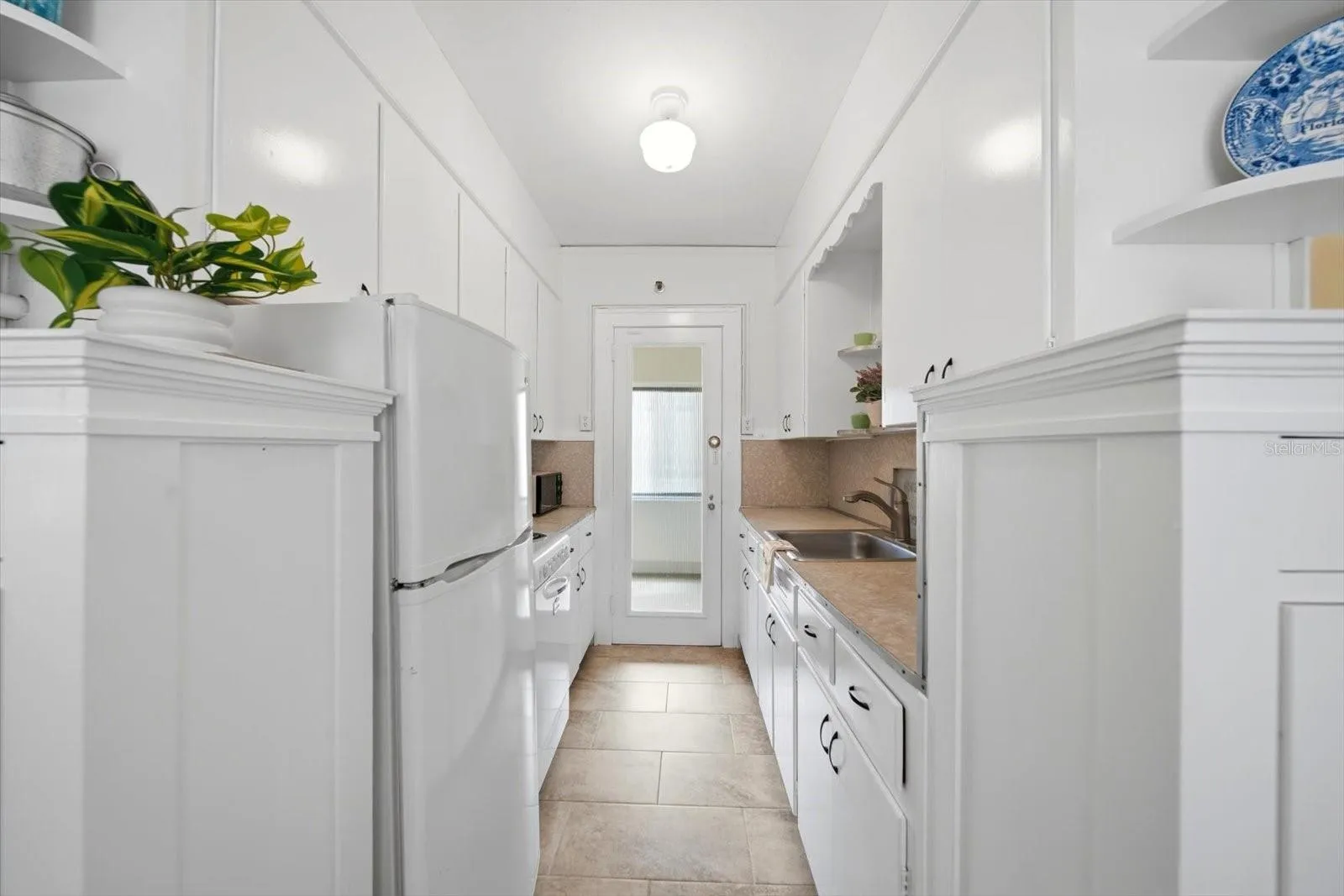 New tile was recently installed in the kitchen.