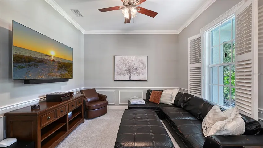 Spacious den with platation shutters