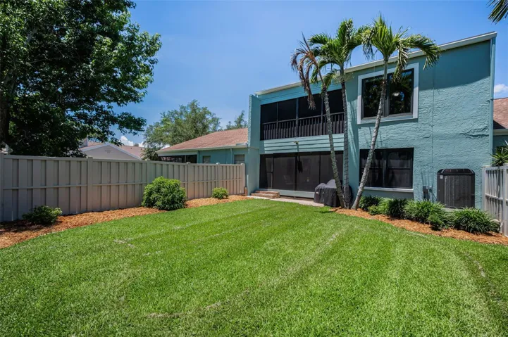 Looking out over the beautifully manicured, fenced private yard — an ideal setting for morning coffee, quiet afternoons, or relaxing evenings at the end of the day.