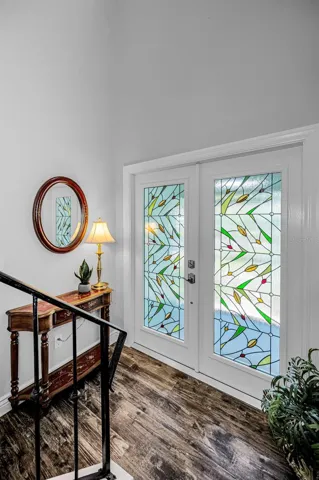 Step inside your screened front porch into this light and bright exceptional residence.
