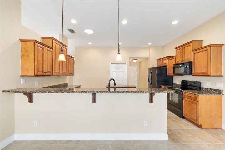Kitchen anchors the home