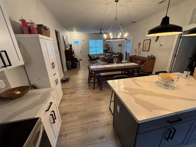 Open kitchen overlooks dining/great room