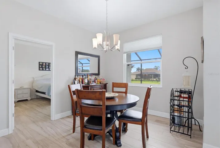 Primary bedroom is off the kitchen and dinette side of the home