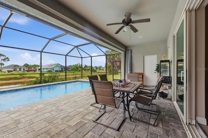 Hurricane shutters to enclose covered lanai and door to pool bath