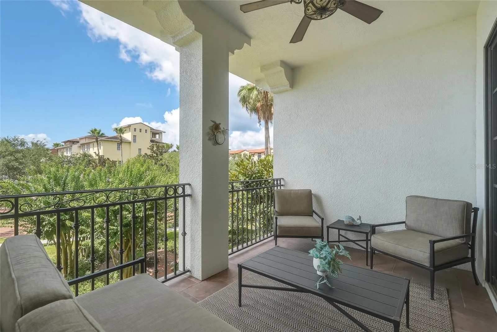 This balcony is an extension of the home- great place to relax under the fan and in the shade.
