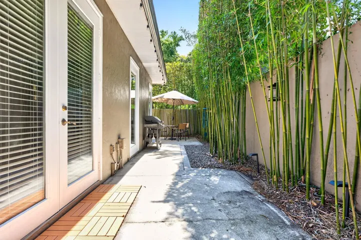 French doors open to the private outdoor patio and backyard retreat.