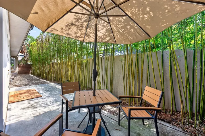 French doors open to the private outdoor patio and backyard retreat.