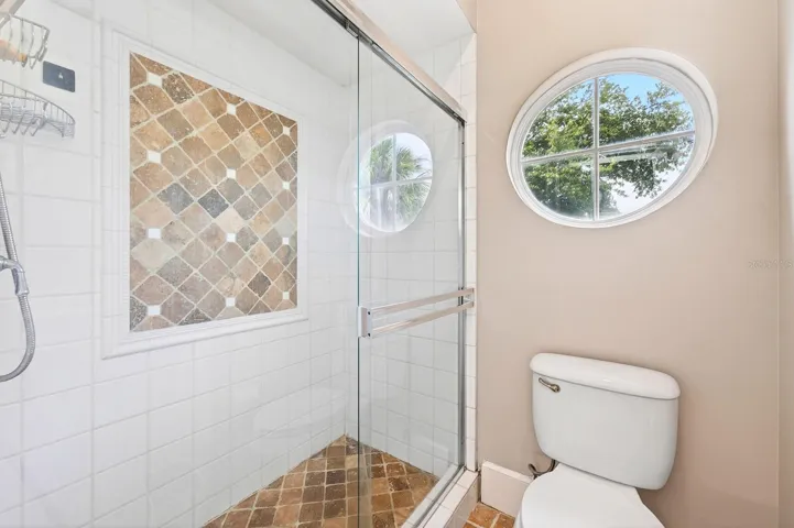 The Primary EN SUITE BATH boasts dual sinks, a garden tub, and a step-in shower.