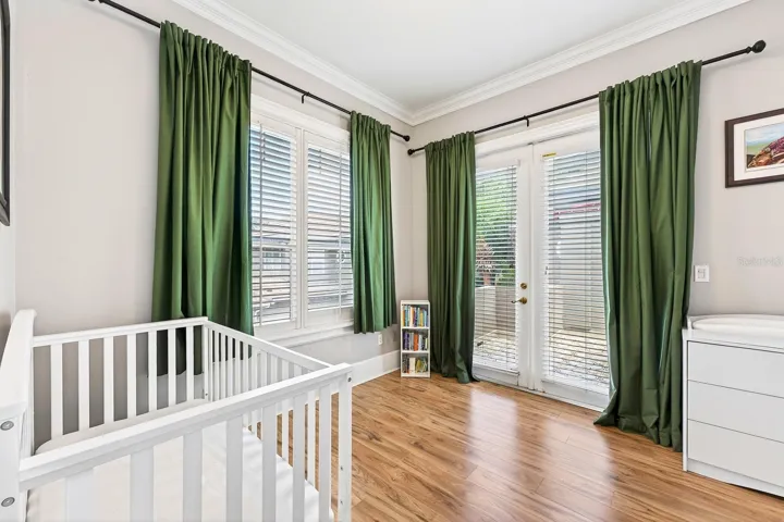 A third bedroom on the second floor offers its own unique charm with French doors opening to a PRIVATE ROOFTOP BALCONY—the perfect place to unwind and enjoy the peaceful surroundings.