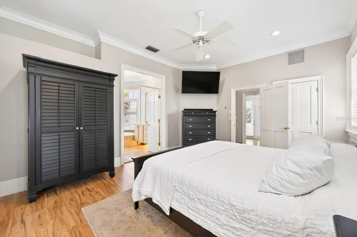This elegant Primary Suite retreat features a DRAMATIC BALCONY overlooking the Living Room below, a walk-in closet, and a spacious EN SUITE BATH.