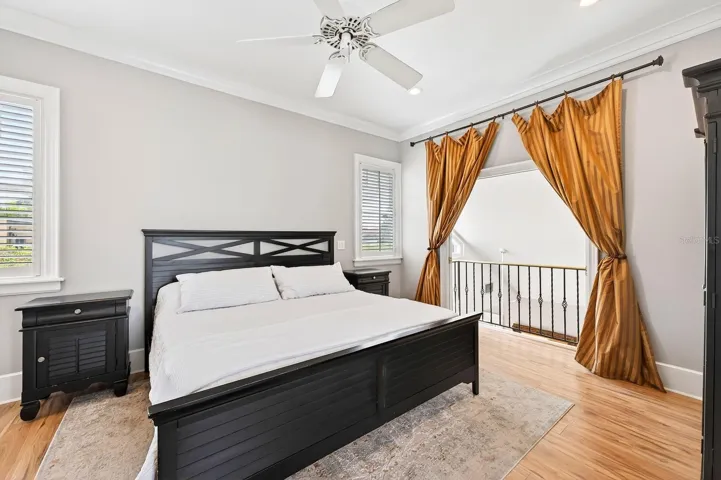 This elegant Primary Suite retreat features a DRAMATIC BALCONY overlooking the Living Room below, a walk-in closet, and a spacious EN SUITE BATH.