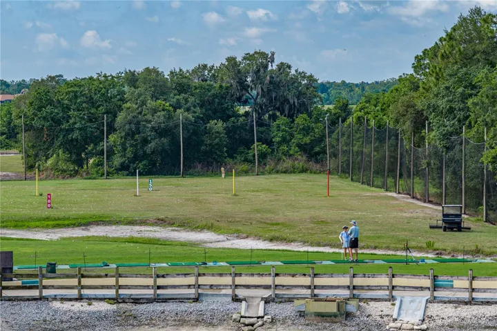 Pond behind house & golf course driving range