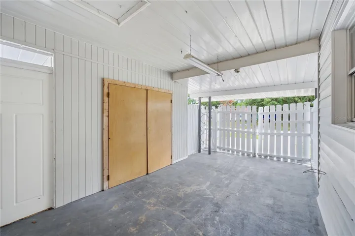 Carport includes a spacious storage closet and door access to backyard