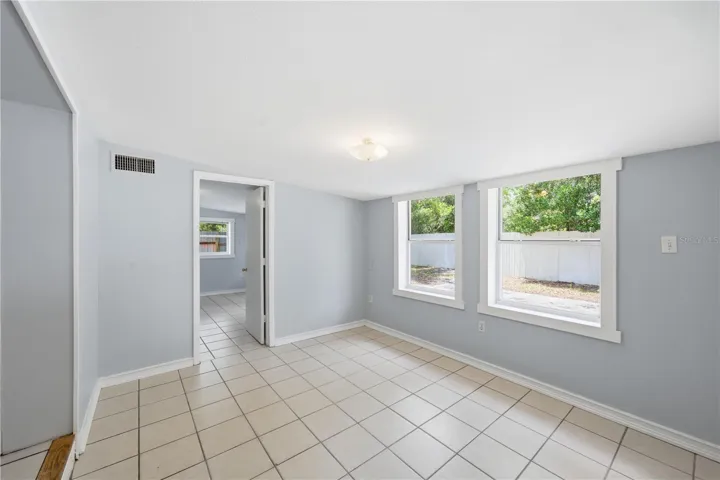 Den/Dining area off the kitchen offers gorgeous windows to bring in the gorgeous Florida sunshine
