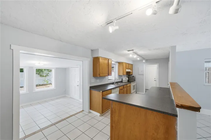 Kitchen includes an abundance of cabinets and countertops for easy dinner prep