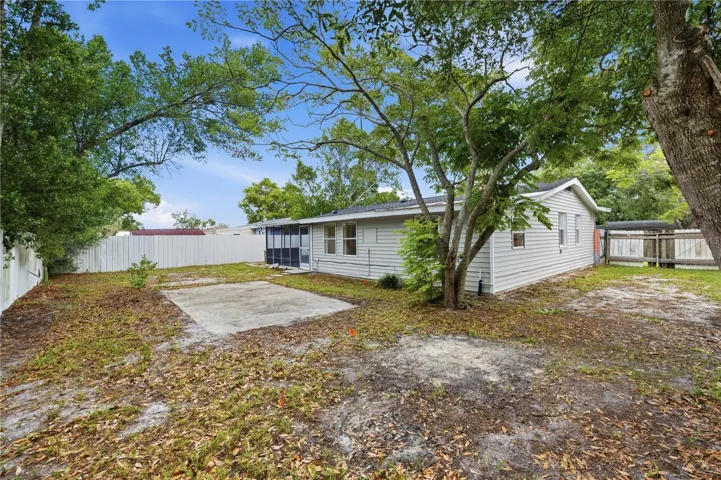 Huge backyard with double wide gate on the side of the house for easy storage of a boat or truck