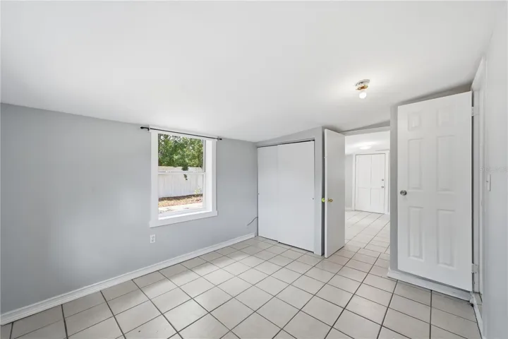 The back bedroom is accessed through the den and also has a door with access to the middle bedroom. Perfect situation for an office or nursery