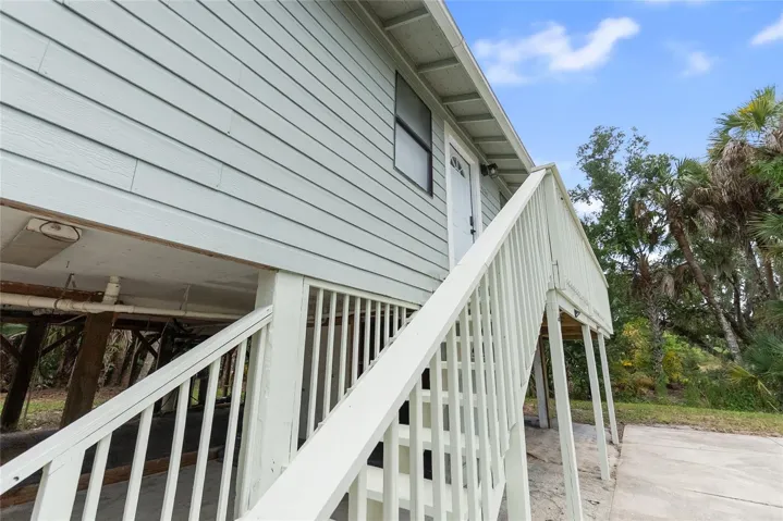 Stairs to entrance on second level.