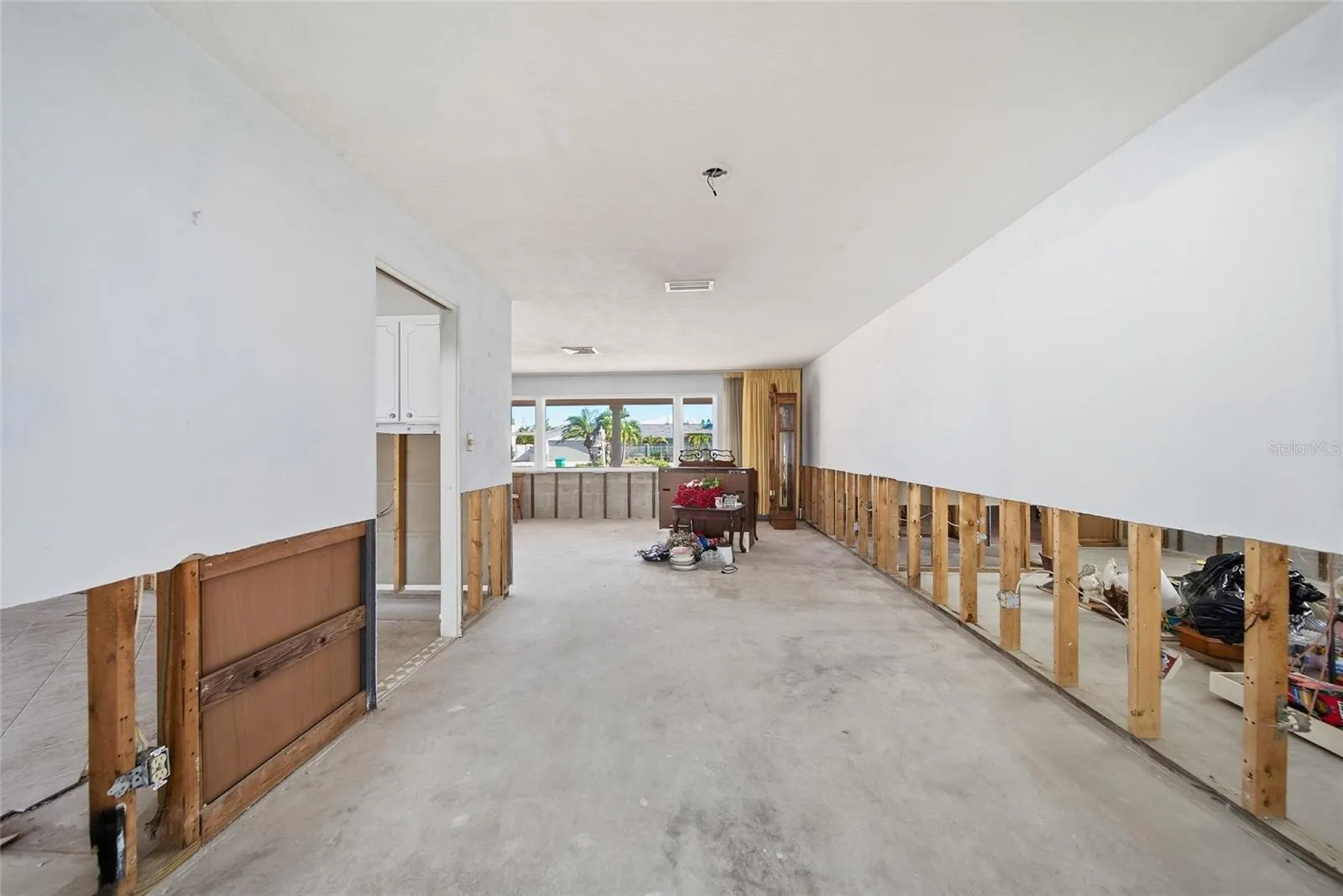 Extension of living room leading back to the family room.