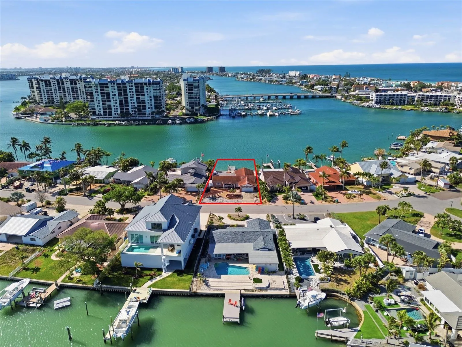 Drone shot looking down at 4 Bellevue and south to The Devil's Elbow and beyond the bridge leading to the beaches and the Gulf of Mexico.
