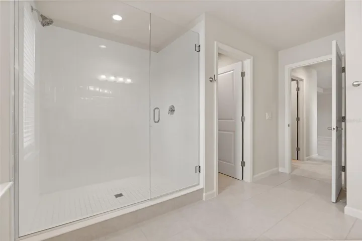 Oversized primary bedroom walk in shower!