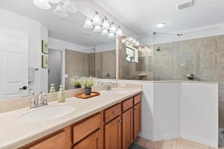 Primary Bath with dual sinks built in Corian Countertops...
